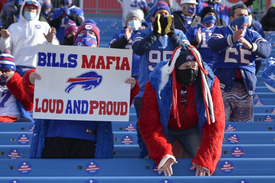 Buffalo Bills fans cheer during the first half of an NFL wild-card playoff football game against the Indianapolis Colts Saturday, Jan. 9, 2021, in Orchard Park, N.Y. (AP Photo/Adrian Kraus)