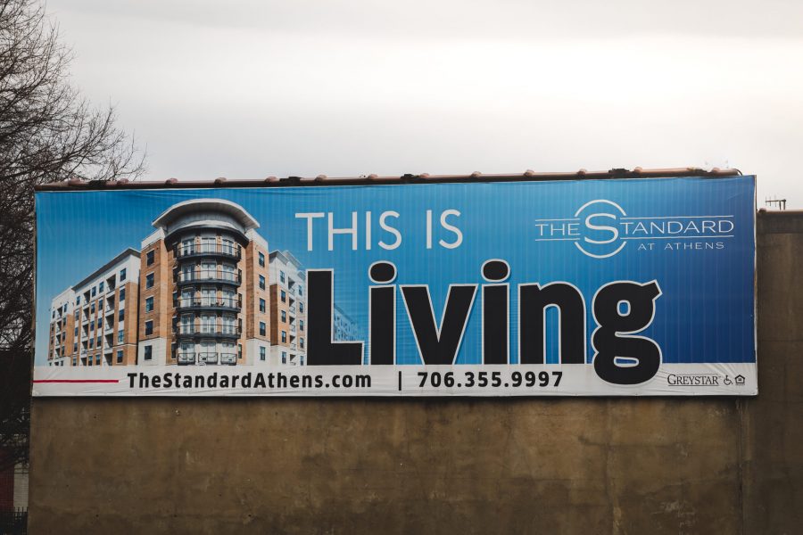 The Standard billboard advertising to students to live there - Photo by Eli Hogan