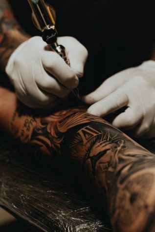 Accepting the Ink: Tattoos in the Workplace – Vanguard