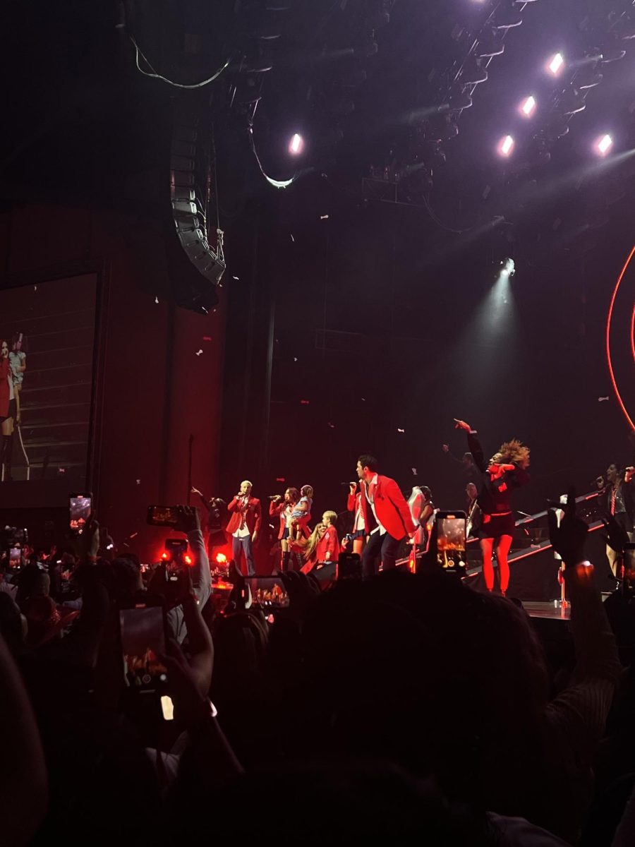 RBD plays their debut song, “Rebelde” (Rebel), an anthem for young people facing the challenges of adolescence and navigating their identities, with members Anahí and Dulce bringing their kids onto the stage.
