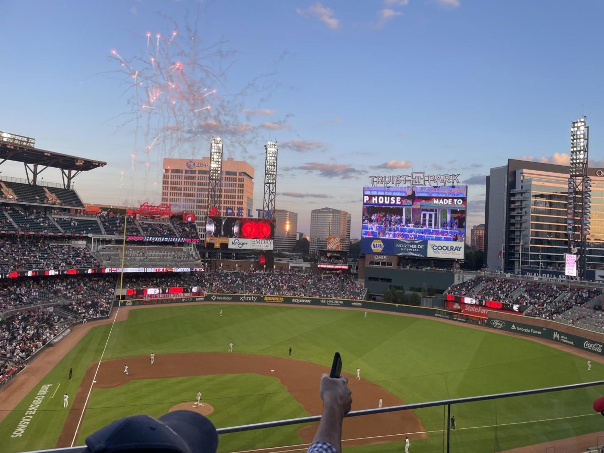 Fans in Truist Park celebrate an Ozzie Albies home run against the Philadelphia Phillies on Sept. 18. Despite losing the game 7-1, Atlanta clinched a postseason first-round bye, giving them home-field advantage through at least the NLDS. 