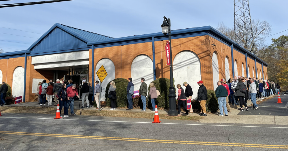 A line wrapped around the Albert L. Stone Elections Building in Canton, Ga.
in the 2022 for the Georgia Senate runoff elections.
