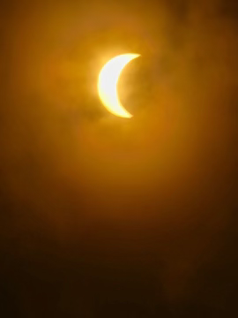 Another angle of the eclipse captured through a pair of glasses, producing a magnificent glow.
