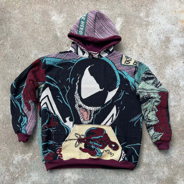 A "Venom" themed hoodie made by cross cutting the tapestry into a focus shot of Venom, while the pocket is made   from stitching a corner of a completely different tapestry.