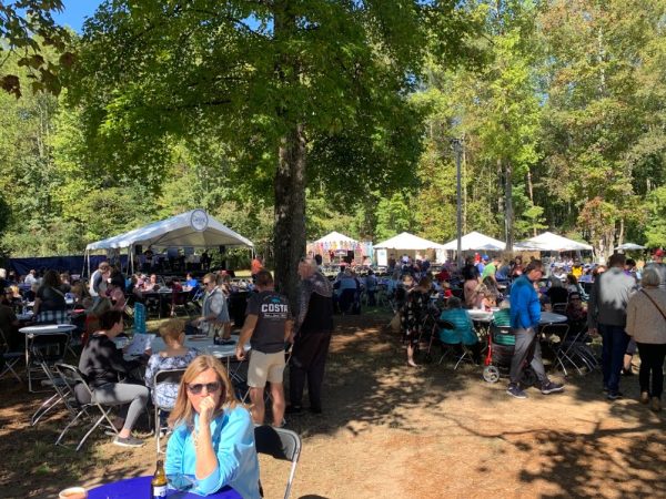 The Cumming Greek Festival had tables filled with attendees eating authentic cuisine while listening to live music. 