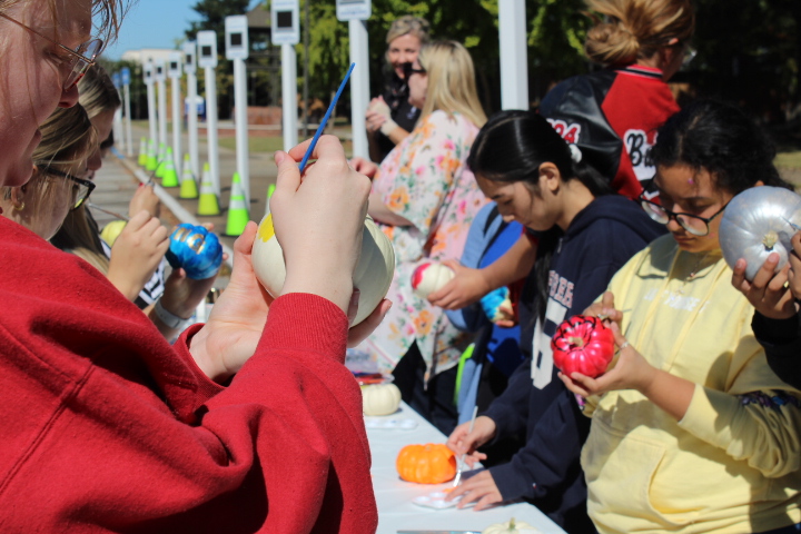 First Gen Students got a chance to relax with peers and paint pumpkins in the sunny weather.