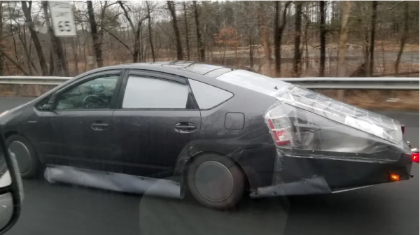 Aerodynamic "modifications" to a 2017 Toyota Prius. Self made side skirts and a back plastic shell have been added to the car.