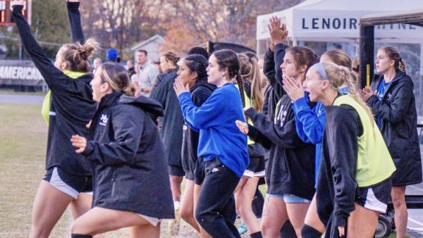 UNG women's soccer team celebrating on sideline during round two of NCAA DII Tournament.