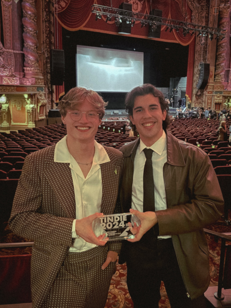 Sam Morgan (left) and the short film's star, Mick Pereira (right) holding the award for "Best Comedy" at the All American High School Film Festival. 