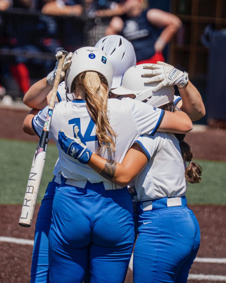 North Georgia Softball team huddling during game one of 2025 NCAA DII Softball National Championship. Photo by David Trotter 