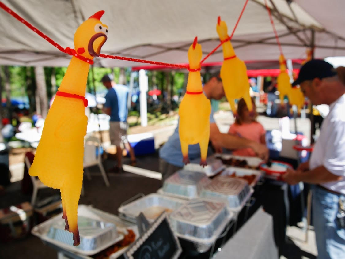 Rubber chickens hanging from the River Roadies' tent during the 2019 Gainesville Chicken Festival. Photo by Austin Steele.