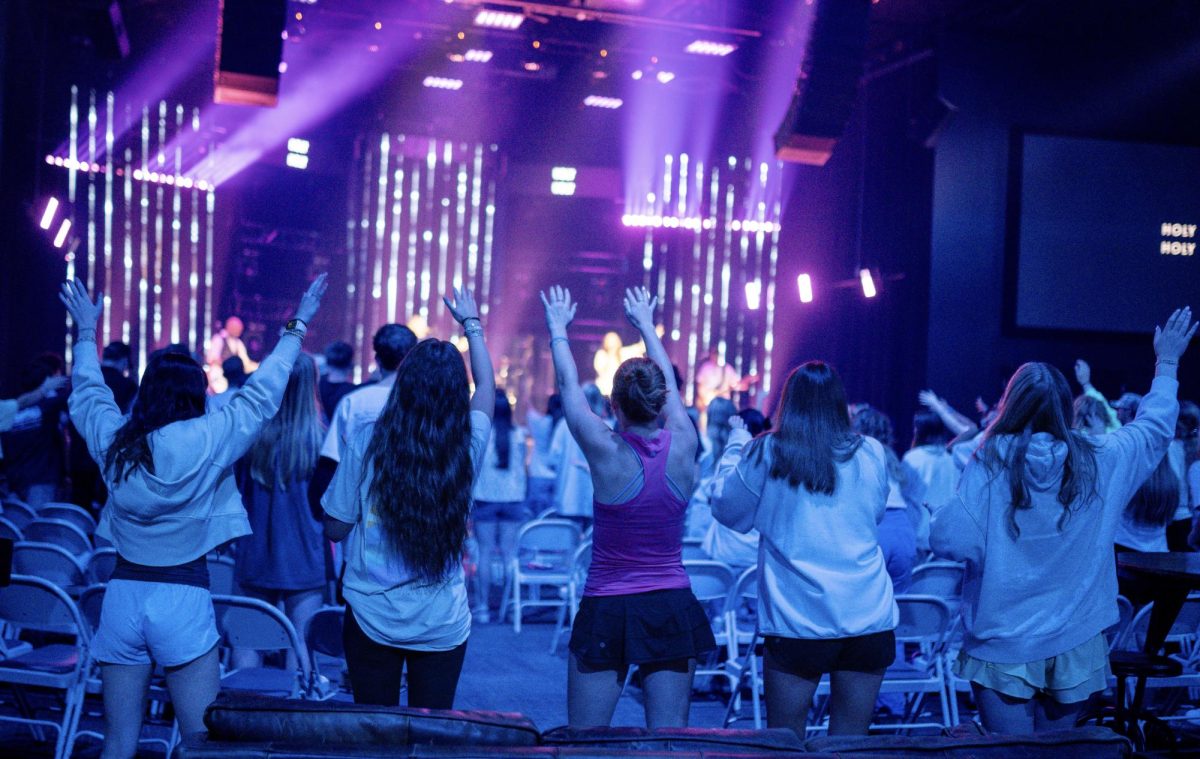Students participating in worship together at The Living Room in Browns Bridge Church.