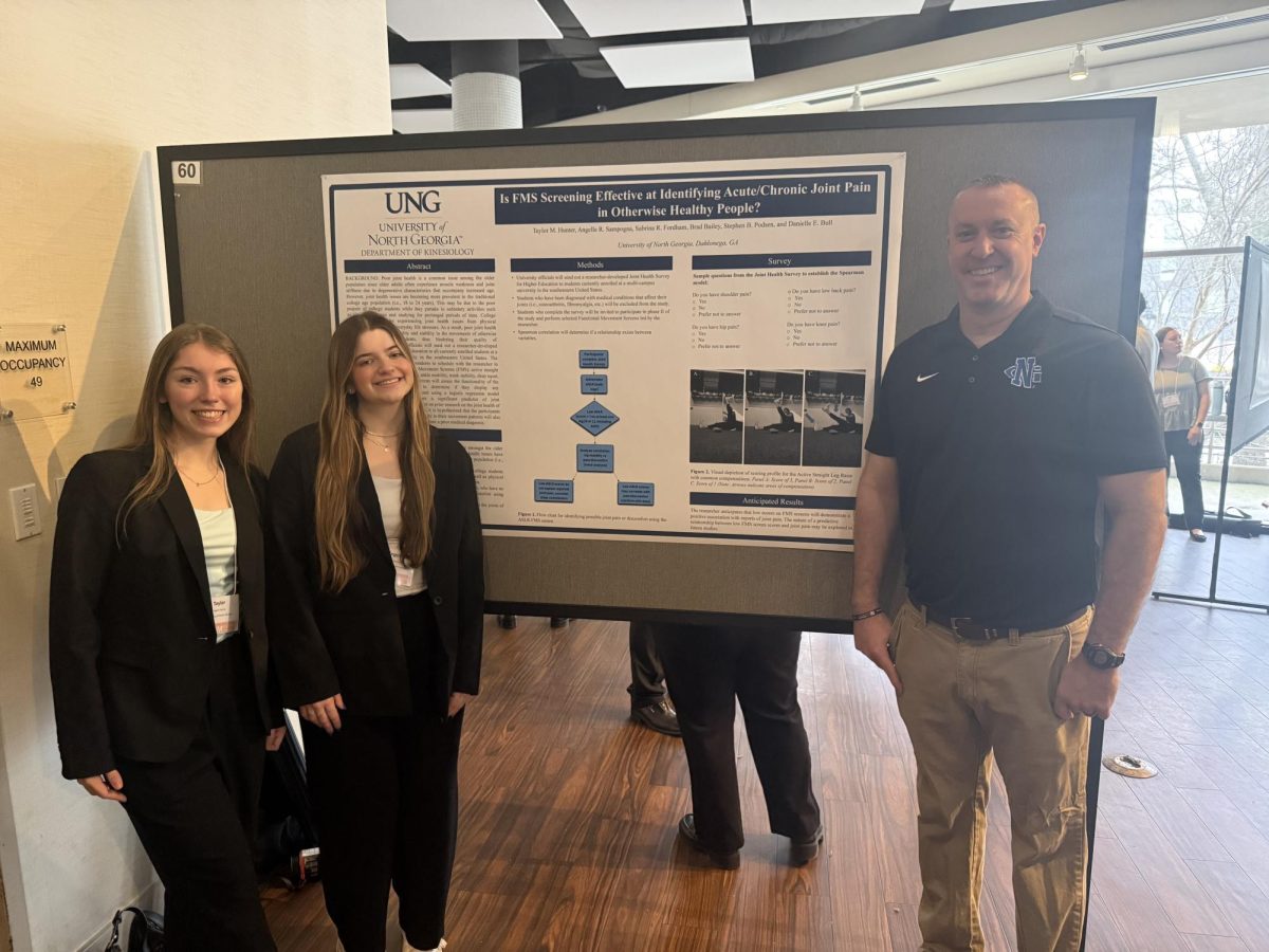 Angella Sampogna (middle) and Kinesiology students at the South Carolina conference.