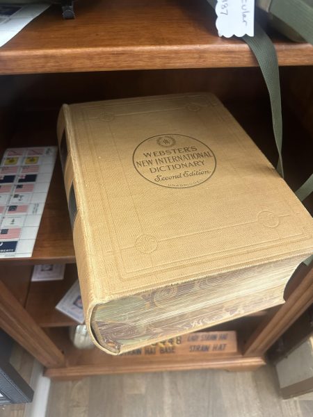 Collectors can find older editions of Webster Dictionaries at antique stores, showcasing both common and rare editions. Photo by Riley Hansen.
